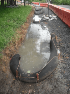 Silt socks can be used as a check structure on a low gradient channel.