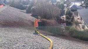 Compost being applied to a highly erodible loess slope on the Port Hills (Source: RST Solutions Limited).
