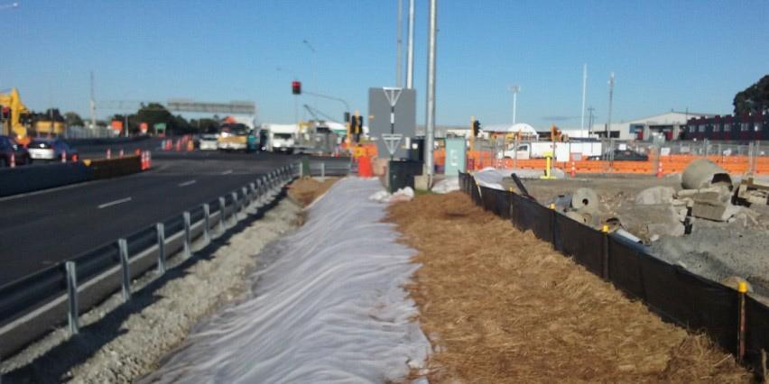 Geotextile cloth on a road construction site has been laid to cover the soil and protect it from rain-induced erosion.