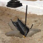 Dirty water will receive flocculent treatment when it flows across a floc sock in the channel upstream of DEB. Note the concrete wingwalls which ensure that the floc sock is not outflanked.