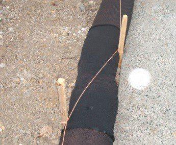 Silt sock joined using a sleeve and pegged and secured using bailing twine with 1 m overlapping joint (Source: Erosion Control Ltd).