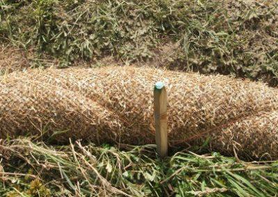 Straw sock secured in place using stakes and bale twine; note the stakes are placed every 600 mm.