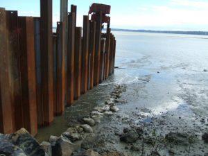 Water draining from a sheet pile coffer dam. A complete seal could not be achieved (Source: SouthernSkies).